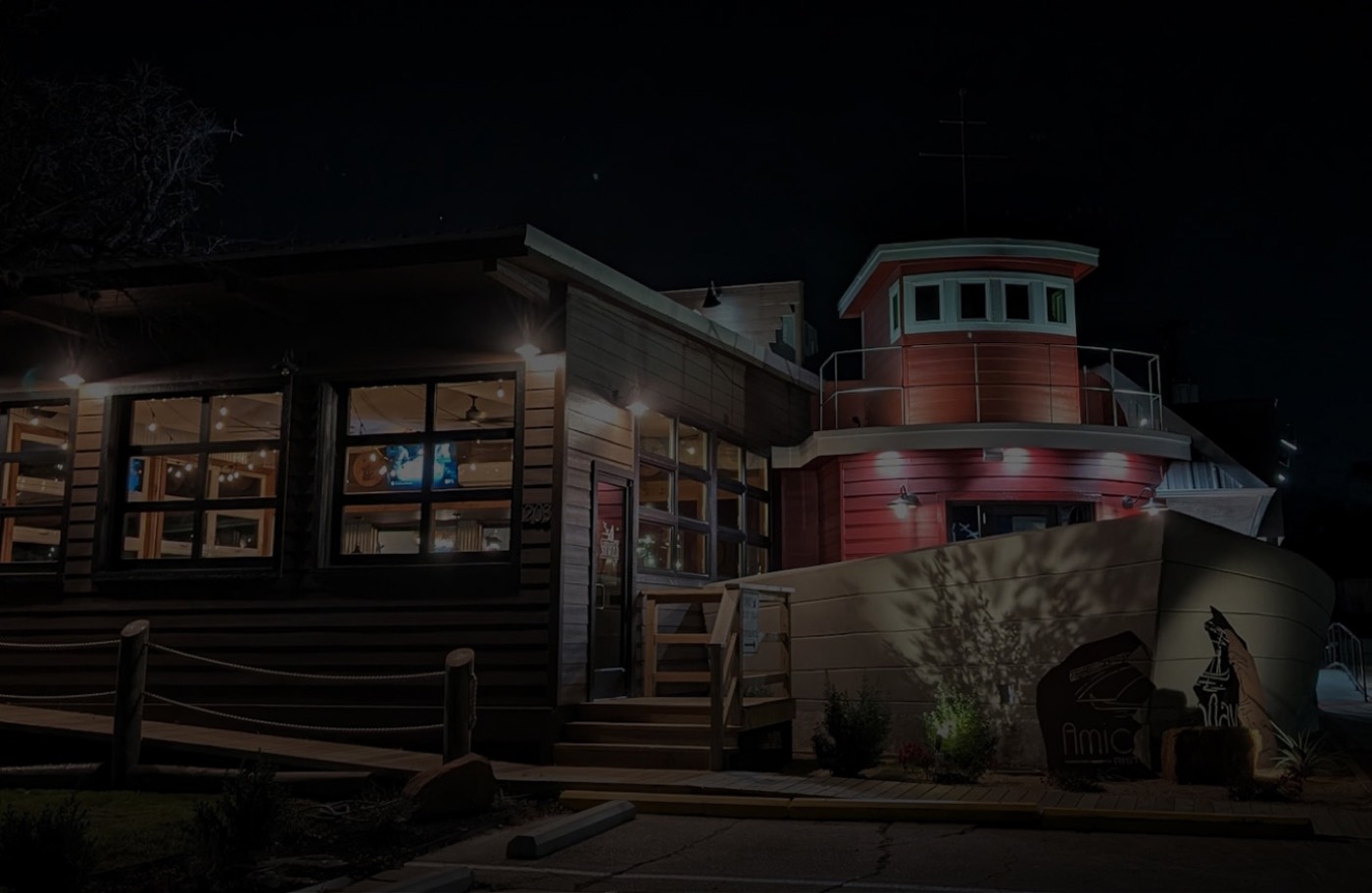 The Shipwreck Grill building lit up at night