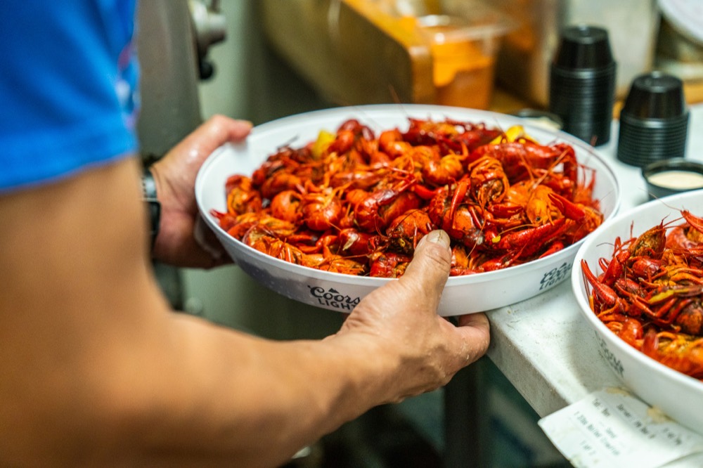 Trays of fresh boiled crawfish coming out of the Shipwreck kitchen