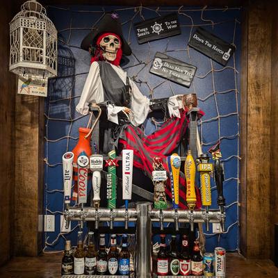 The pirate skeleton keeping watch over the beer taps