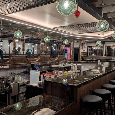 Glass float pendant lights over the boat bar